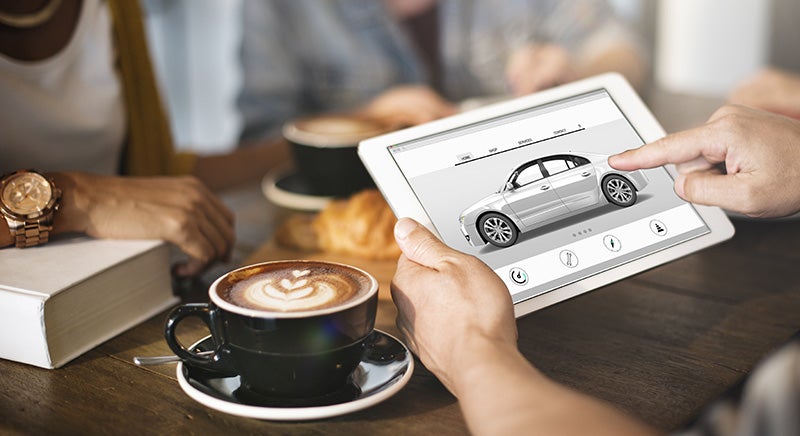 customer with tablet and coffee